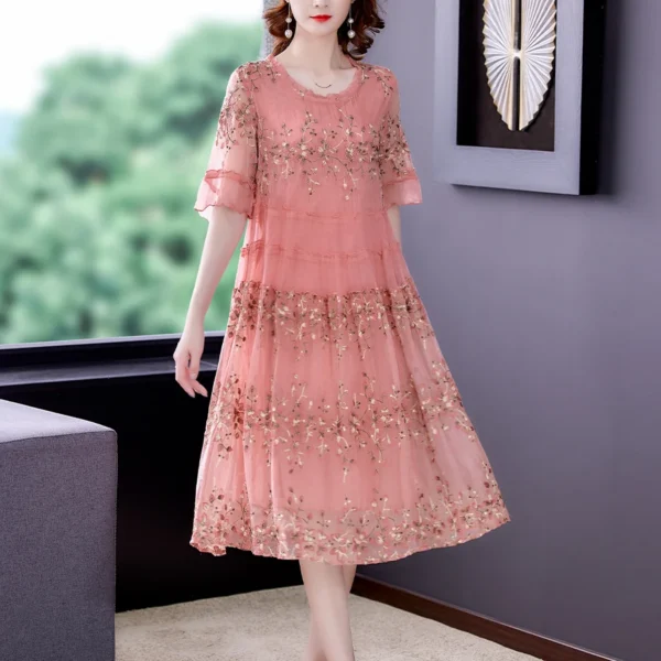 Pink floral dress with embroidery, sequins, and ruffled vintage style